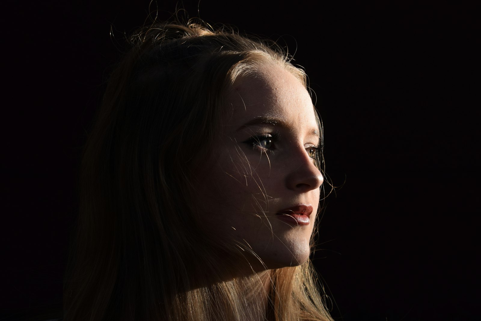 Moody portrait dark background