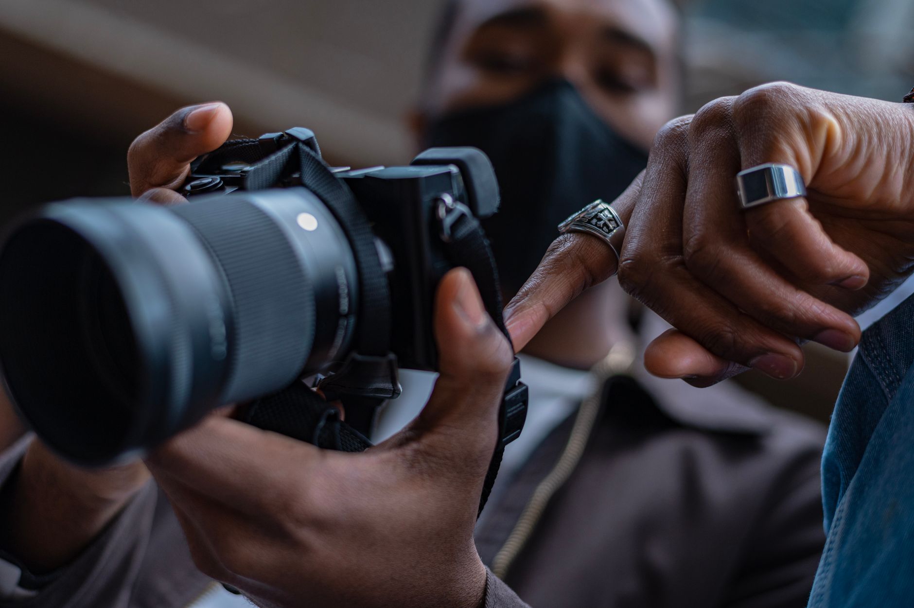 Photographer adjusting camera
