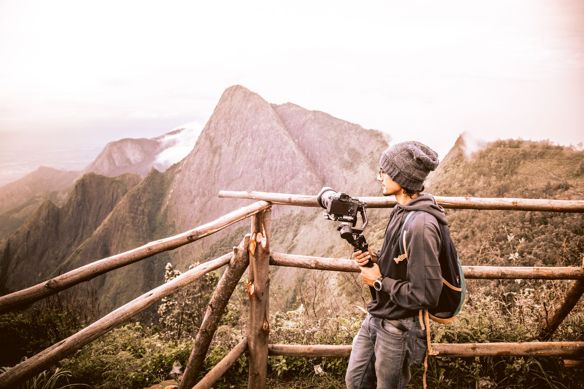 Traveler filming scenic vista